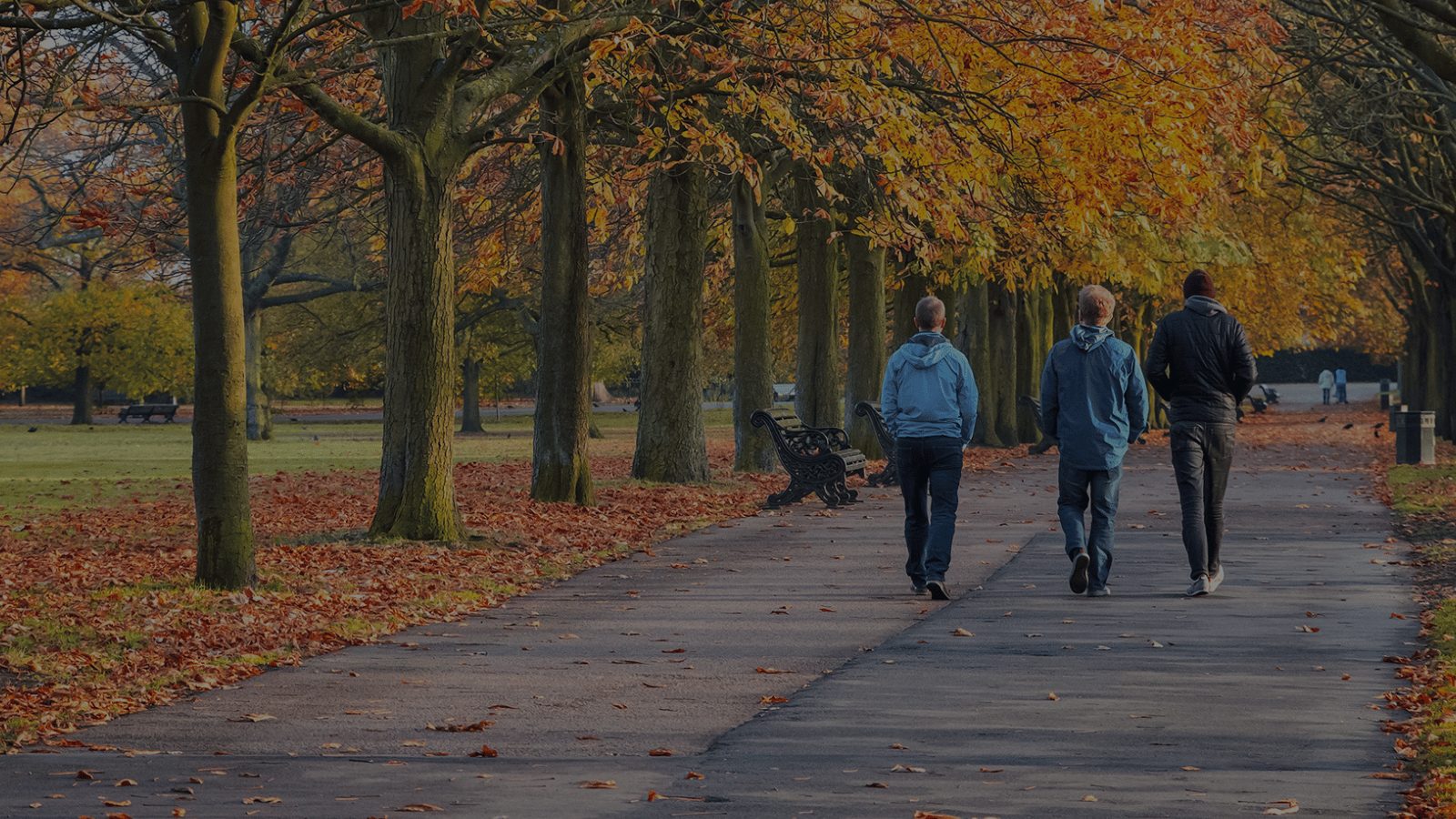 three men walking park